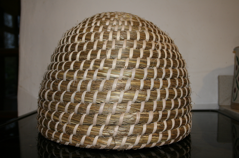 Swarm skep made from flowering stems of purple moor grass